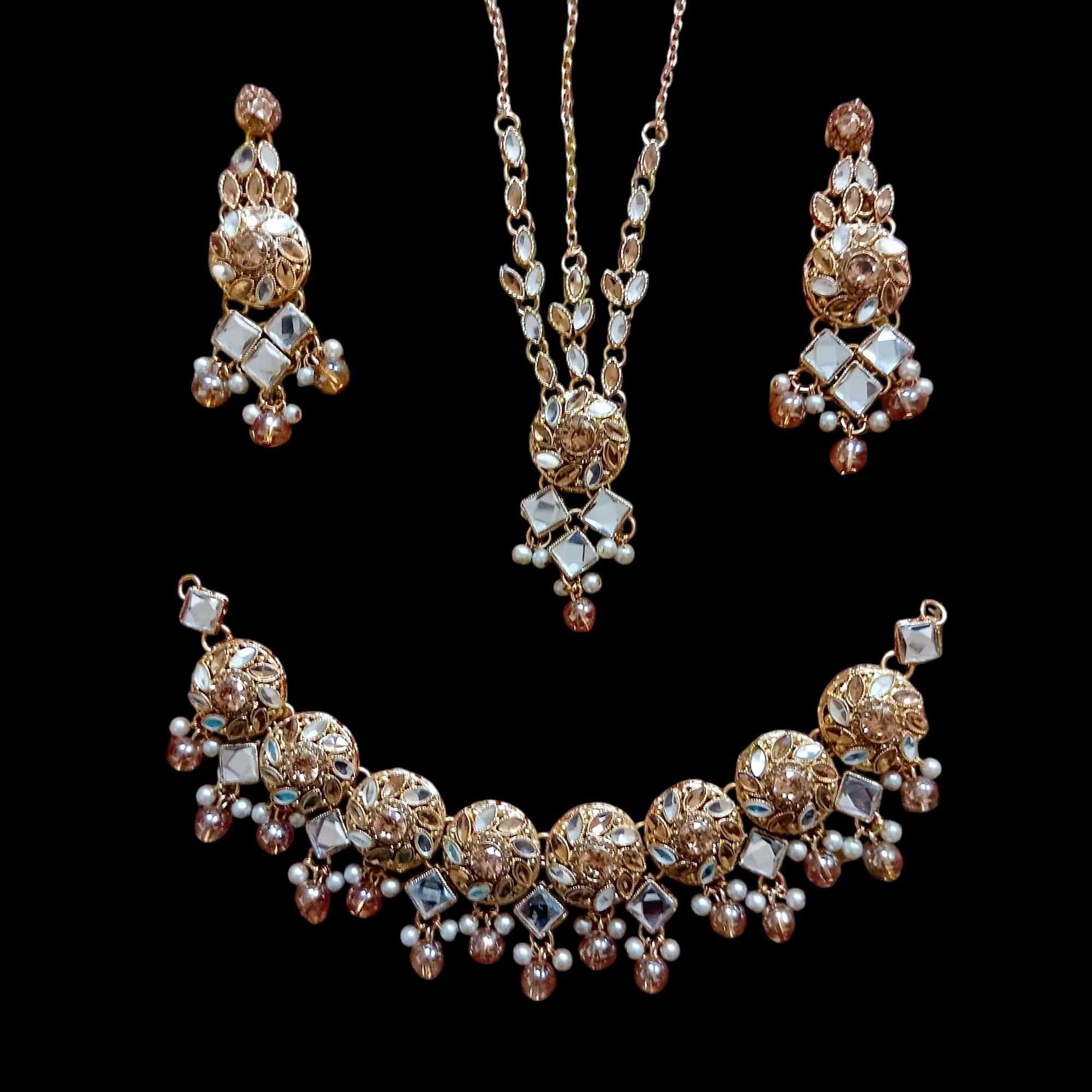 Buy Golden colour jewellery set with necklace , earrings and tikka at best price in pakistan